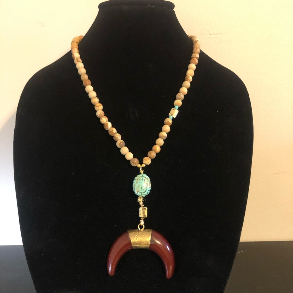 Brown and brass horn pendant with turquoise and jasper beads.